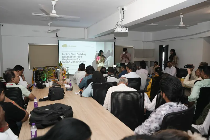 A full room at a FoxScan session in the Pune Experience Centre while a speaker presents on the projector screen.