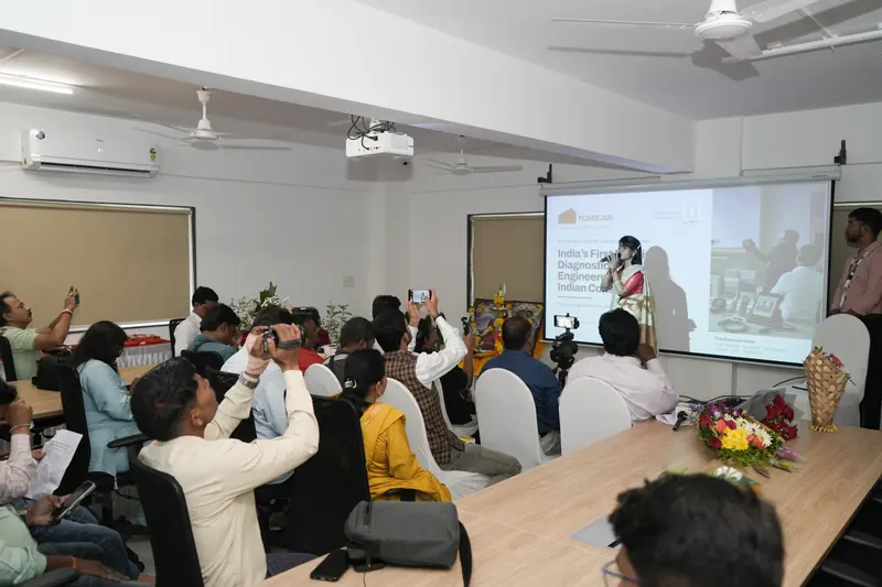 Attendees record a FoxScan speaker presenting at the Experience Centre.